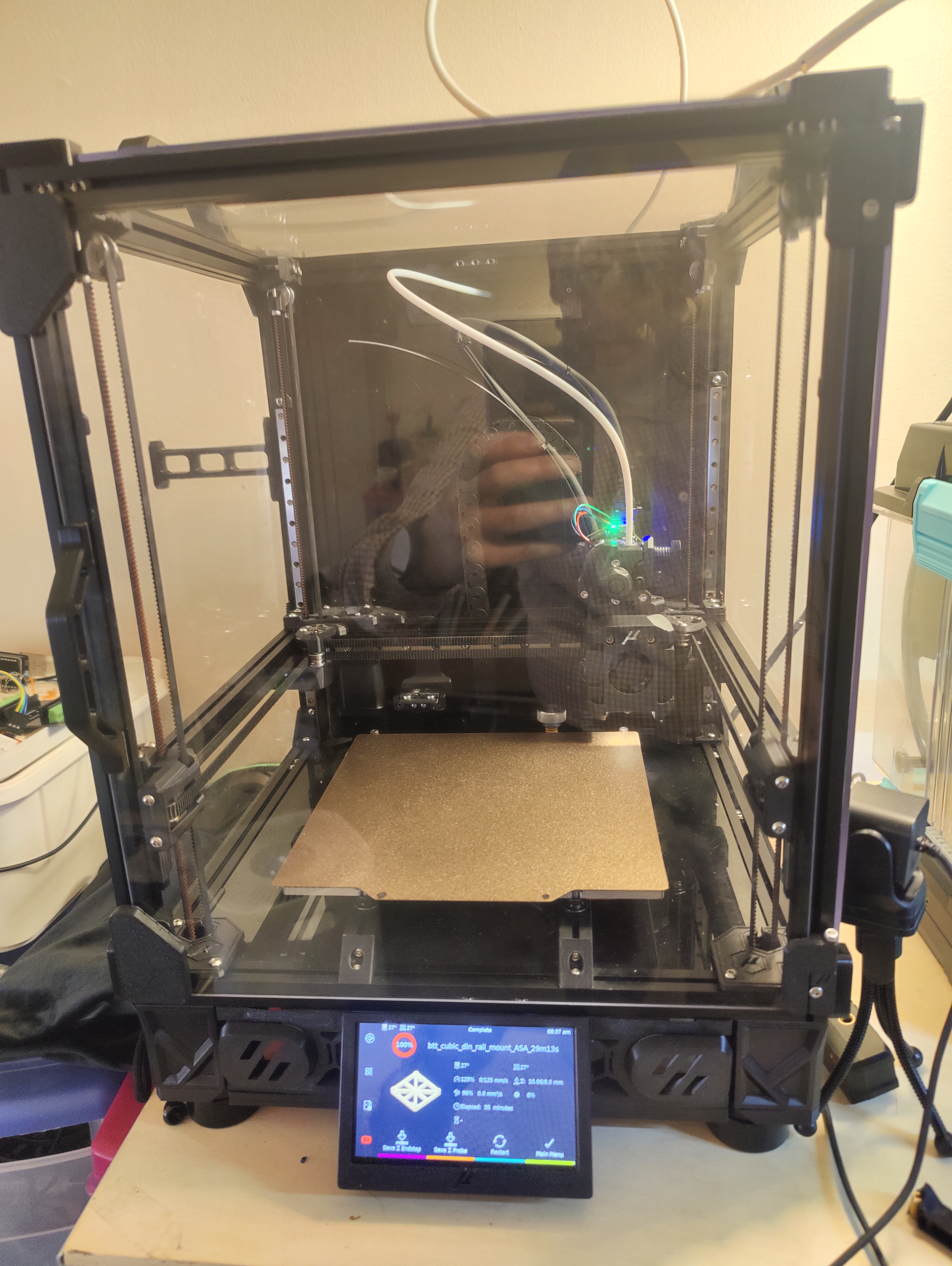 Completed Micron+ with acrylic panels and touchscreen, running a print